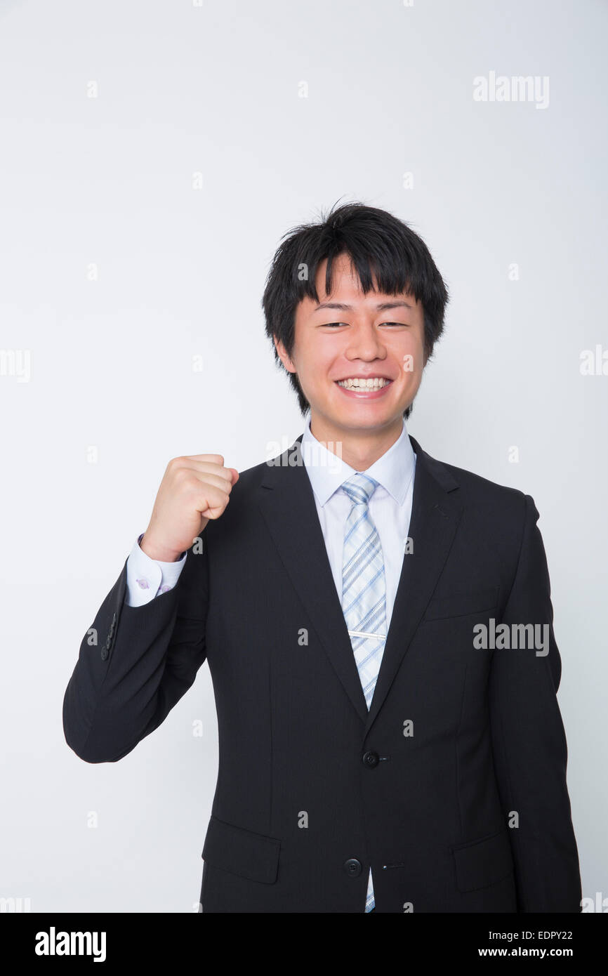 Smiling Businessman Clenching His Fist Stock Photo