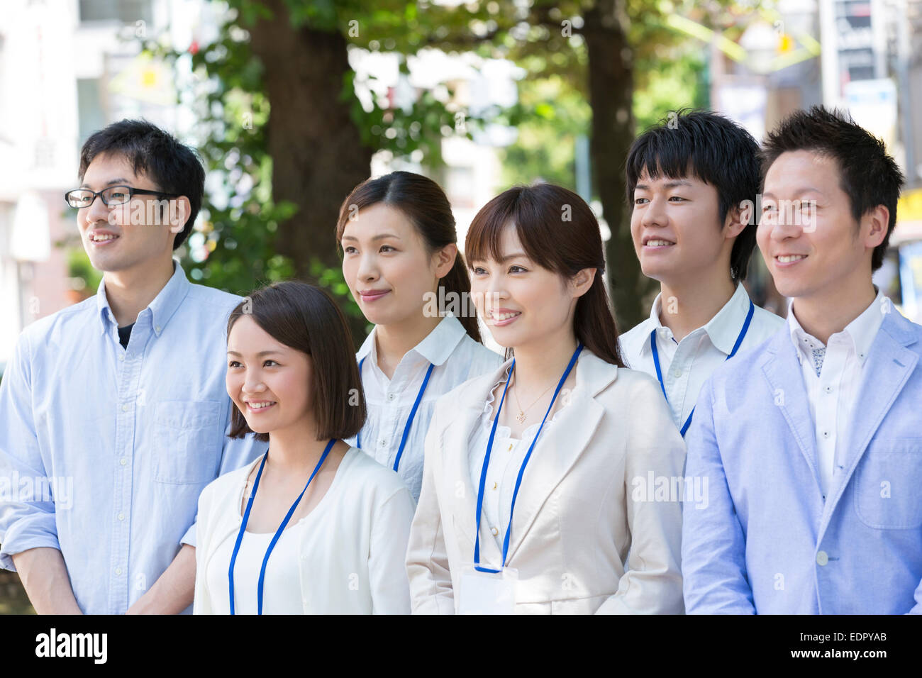 Business People Standing Side by Side And Looking Away Stock Photo