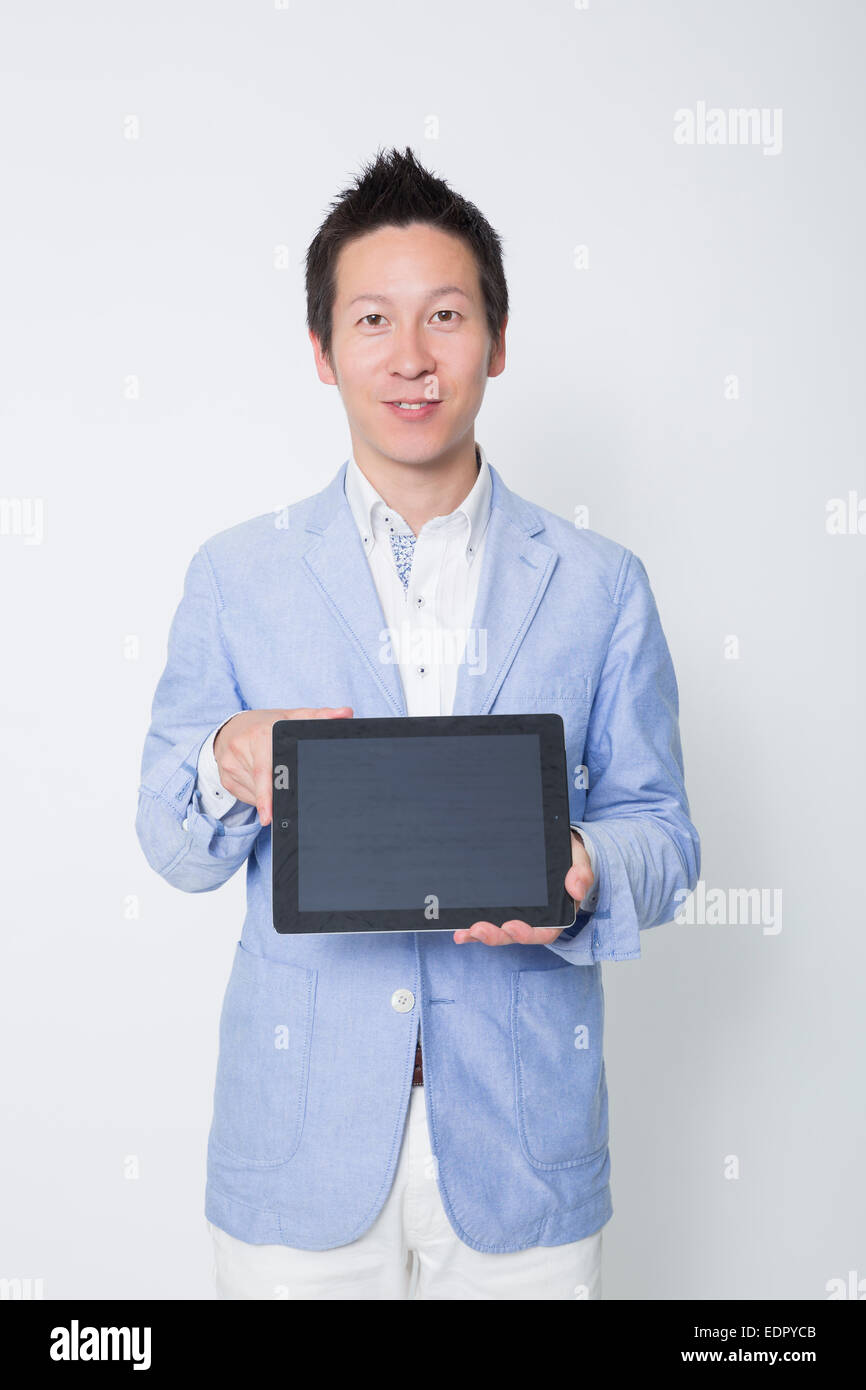 Businessman Holding Tablet Computer Stock Photo