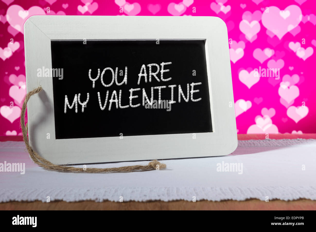 Image of a slate blackboard with chalk message YOU ARE MY VALENTINE and pink background Stock Photo