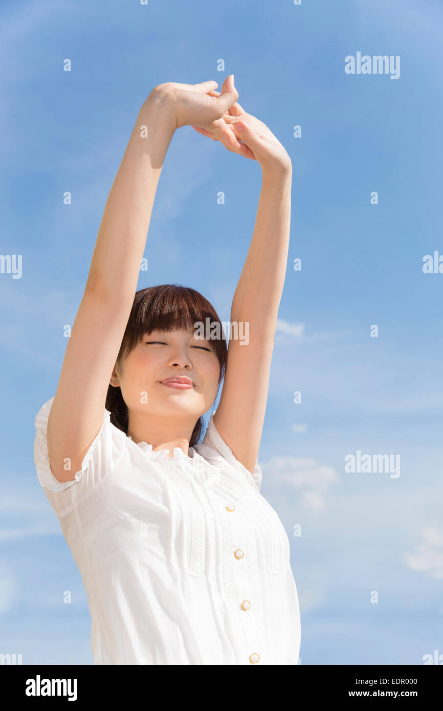 Women stretching arms hi-res stock photography and images - Alamy