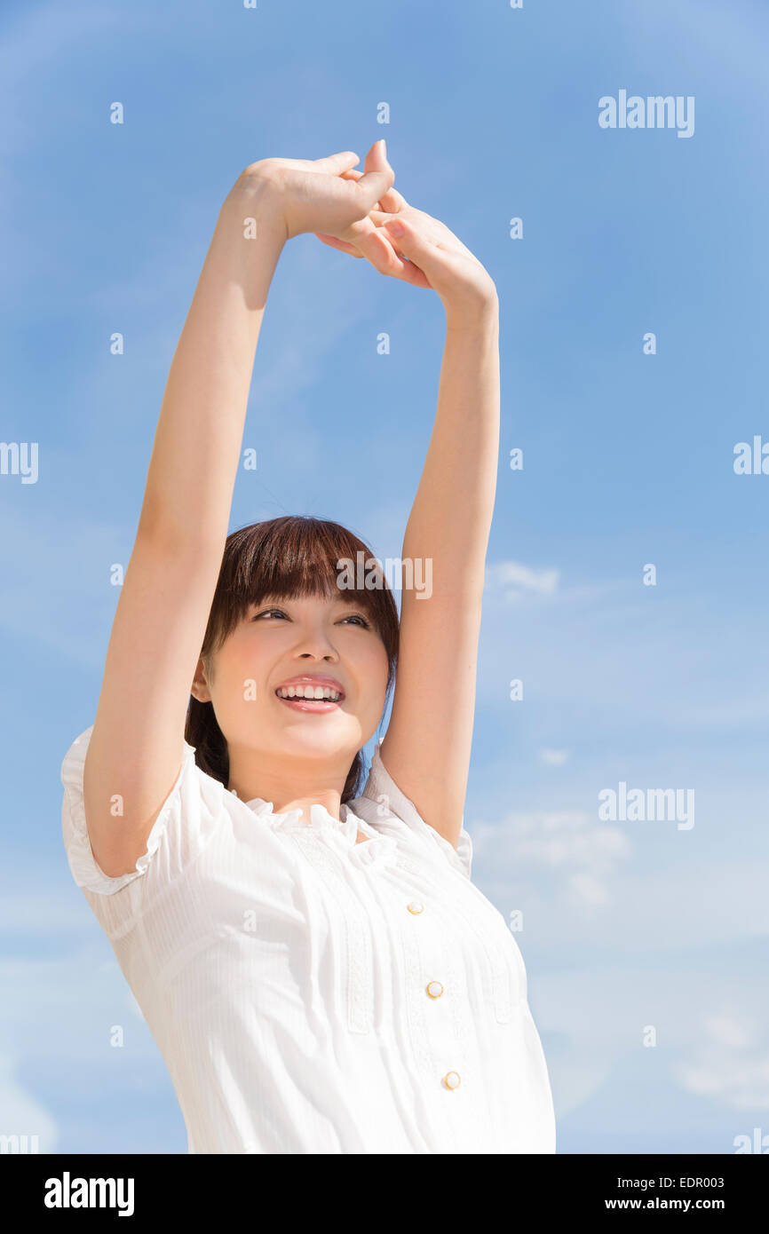 Woman Stretching Her Arms Stock Photo - Alamy
