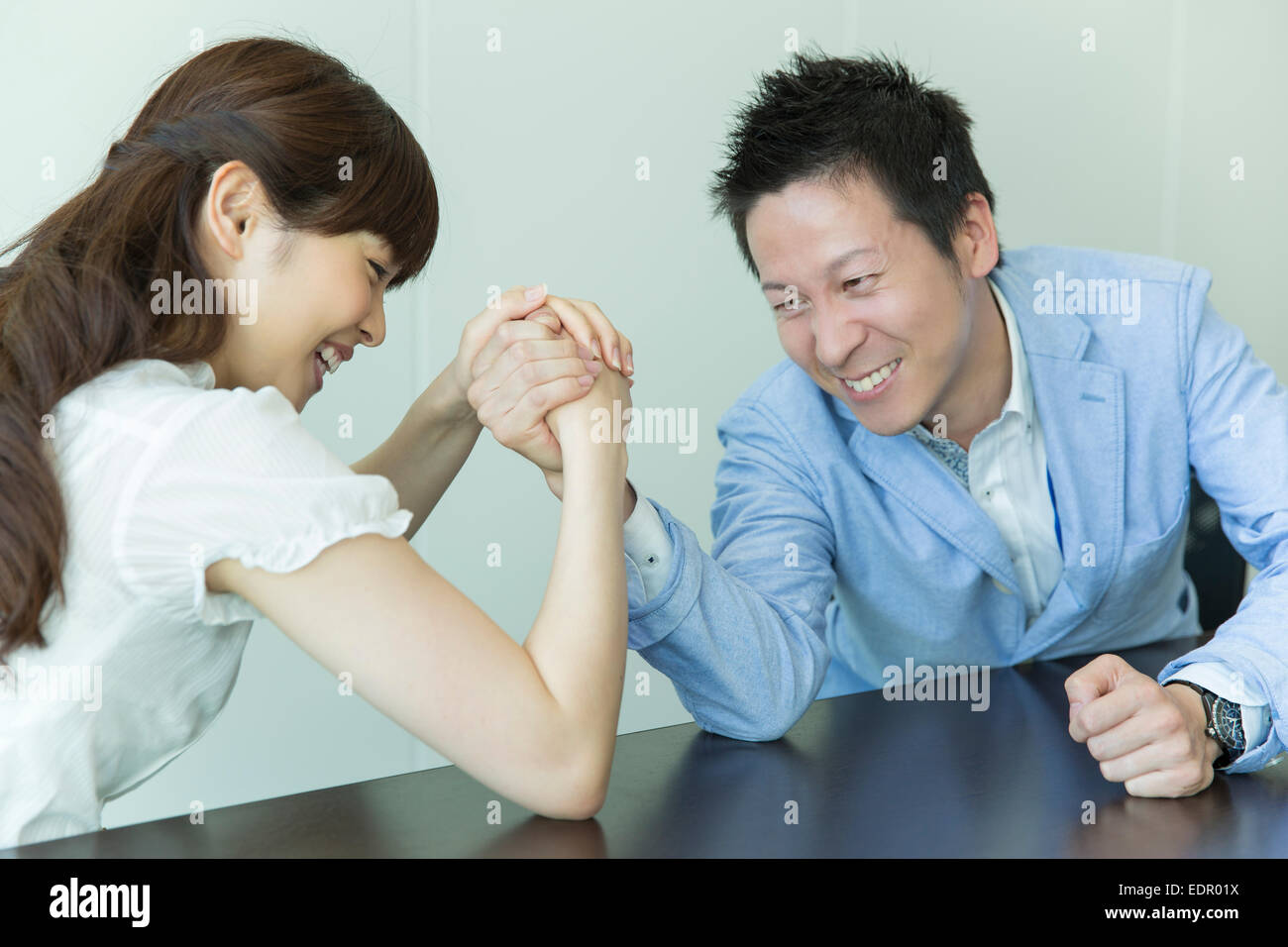 Woman and Man Arm Wrestling Stock Photo Alamy