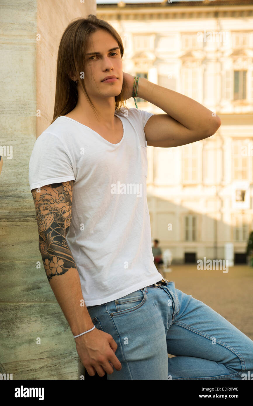 Long hair man with tattoo hi-res stock photography and images - Alamy
