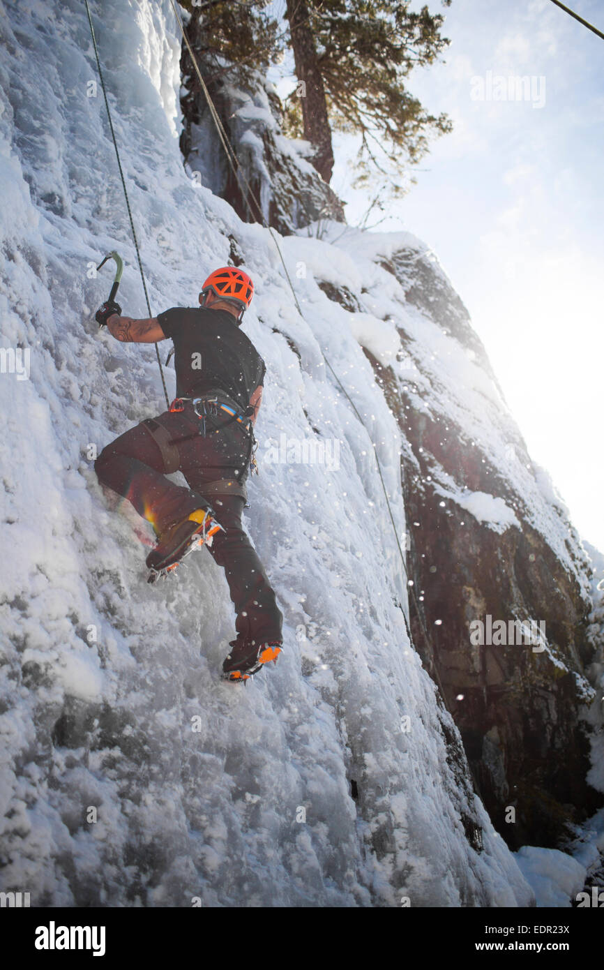 Man at ice climbing low angle view hi-res stock photography and images ...