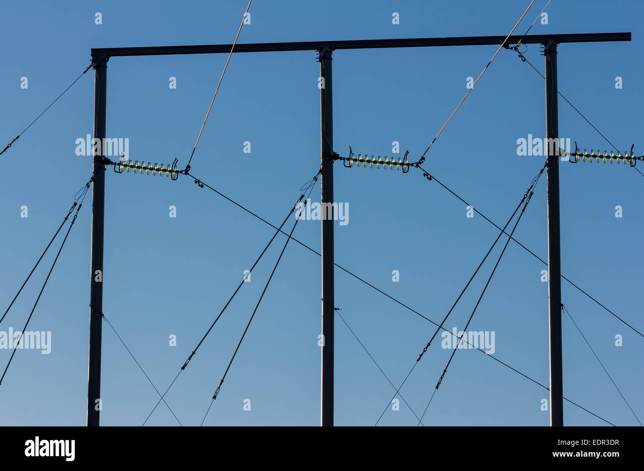 Electric pole against a blue sky Stock Photo - Alamy