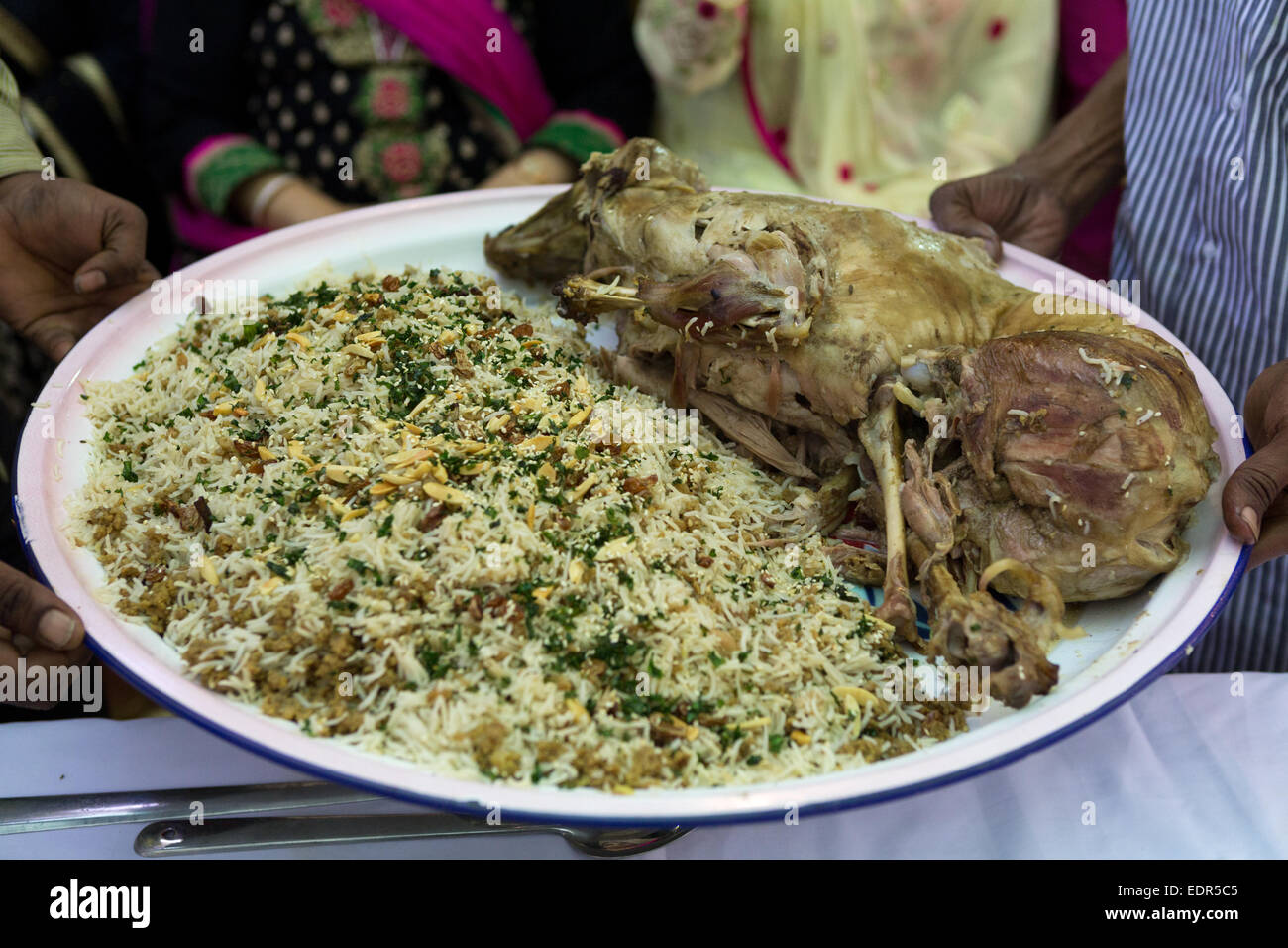 Cooked whole lamb with biryani on a platter Stock Photo Alamy
