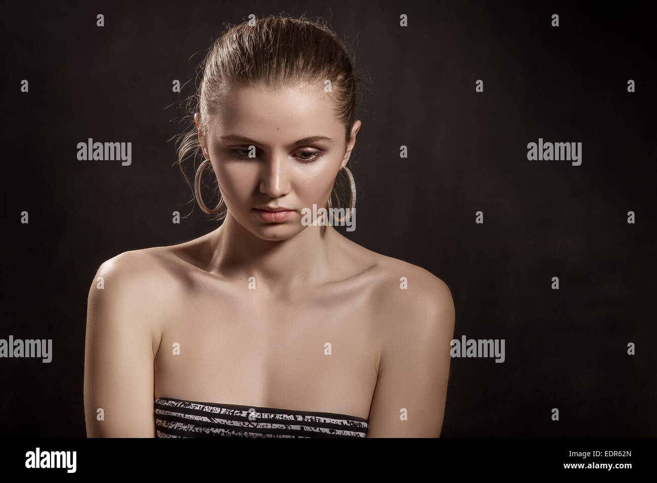 sad pensive girl portrait on black background Stock Photo - Alamy