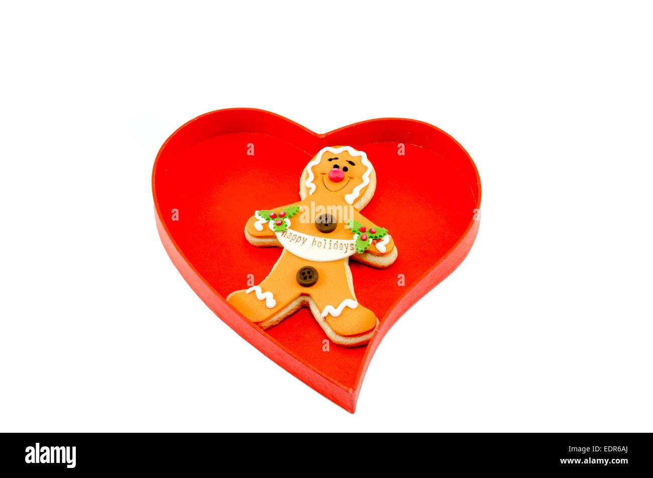 Gingerbread in a heart shaped box isolated on white background Stock ...