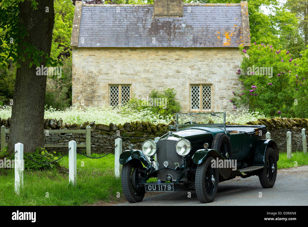 Vintage Bentley four and a half litres luxury car built in 1929 being driven on touring holiday in The Cotswolds in Oxfordshire Stock Photo