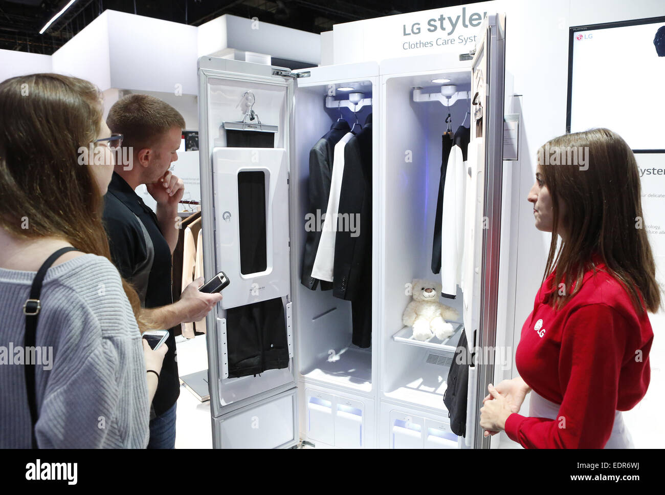 Las Vegas, Nevada, USA. 8th Jan, 2015. MICHELLE COHN, LG's brand ambassador, right, talks about LG's Clothes Care System at Las Vegas Convention Center during the 2015 International CES on Thursday, Jan. 8, 2015. LG Styler is designed to refresh clothes without water or detergents, providing an ideal solution for hard-to-maintain clothes such as suits, coats and sweaters. Credit:  Bizuayehu Tesfaye/ZUMA Wire/ZUMAPRESS.com/Alamy Live News Stock Photo