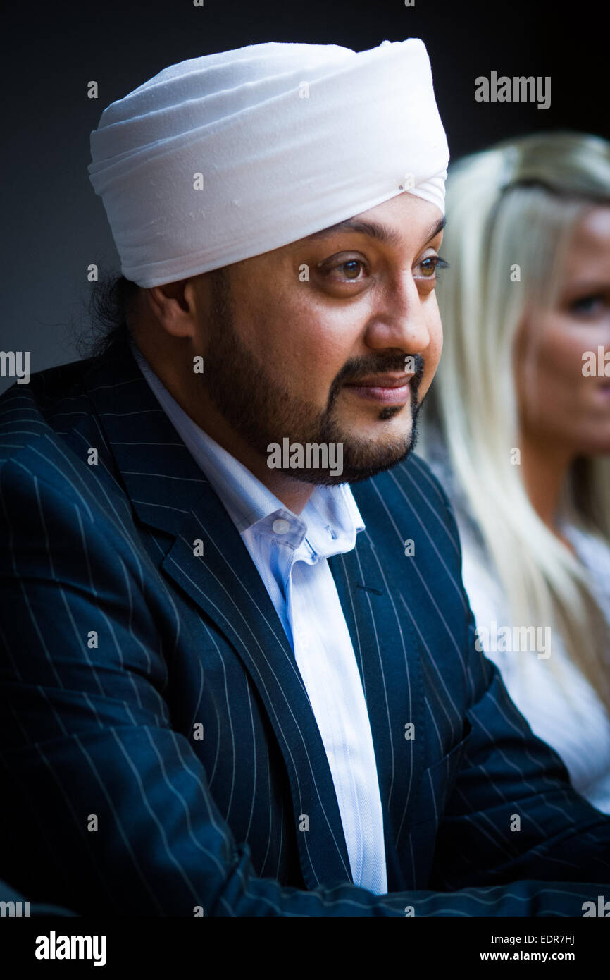 British Asian Sikh Businessman in a boardroom Stock Photo