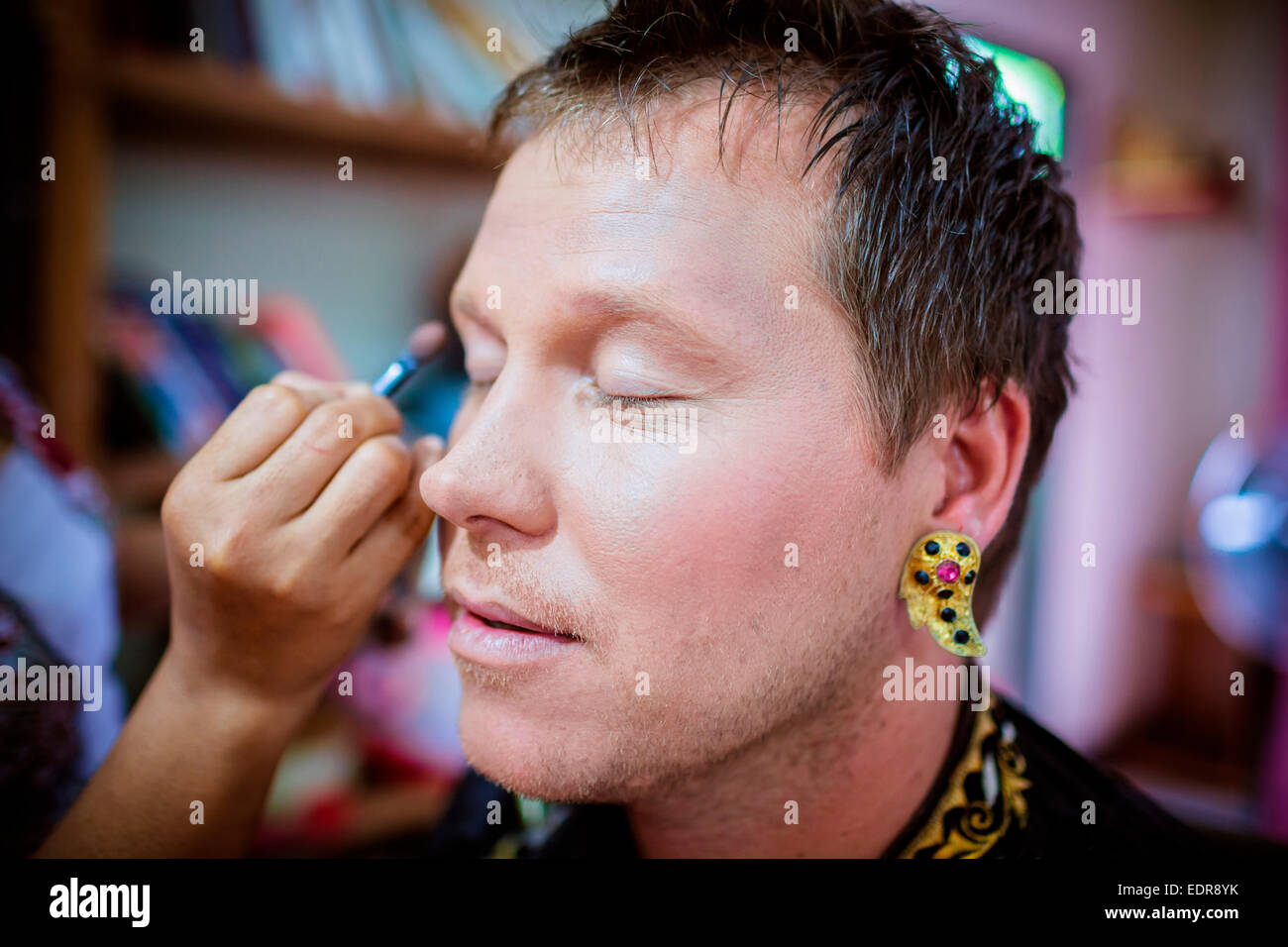 Man enacting wedding scene in preparation for religious ceremony.Bali ...