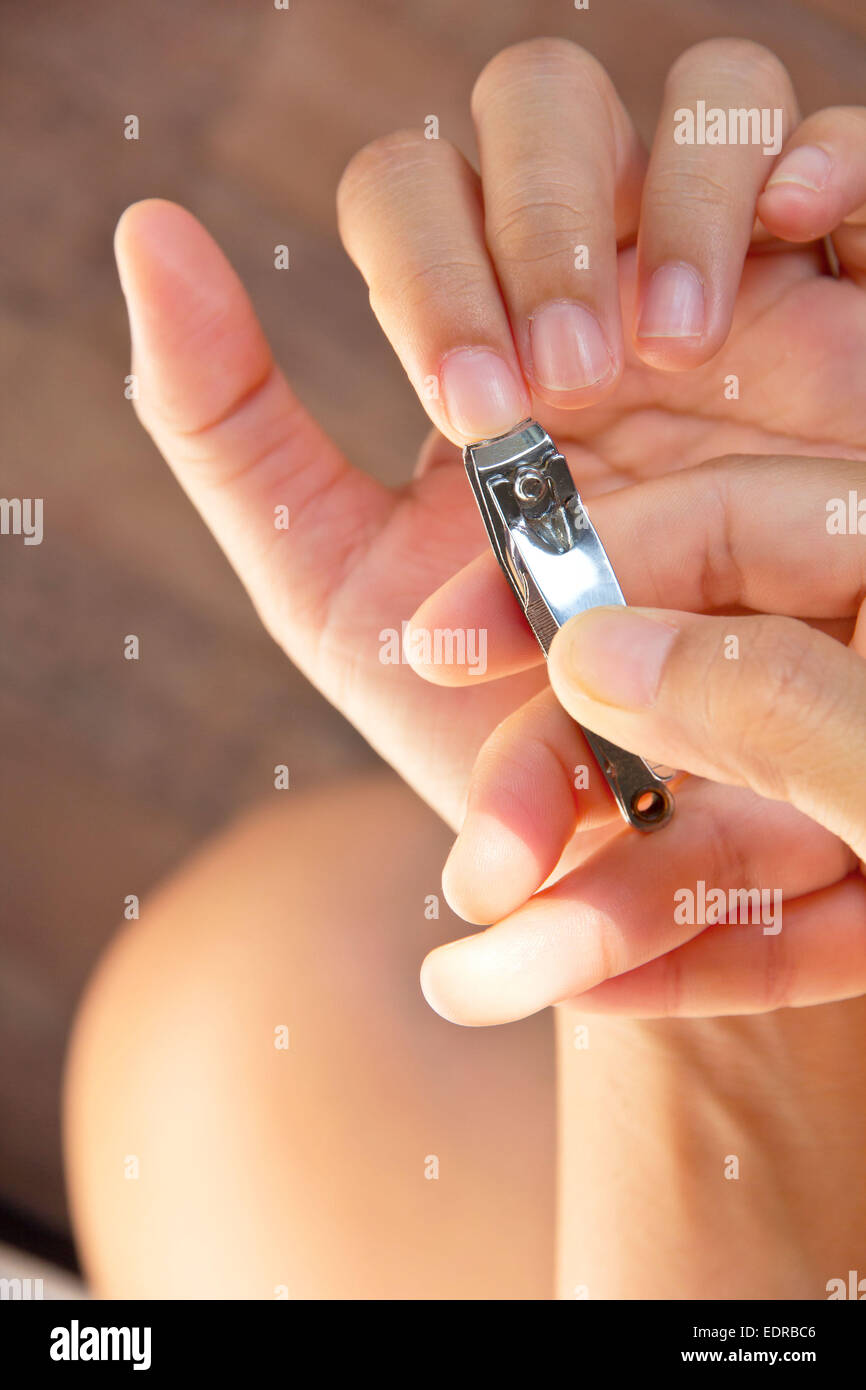 Cutting your fingernails Stock Photo