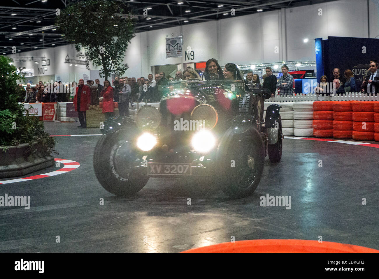 London, UK. 08th Jan, 2015. London Classic car show at Excel London. 1928 Vintage Bentley 4 1/2 Litre tourer driving in the driving display on the Grand Avenue. Credit:  Martyn Goddard/Alamy Live News Stock Photo