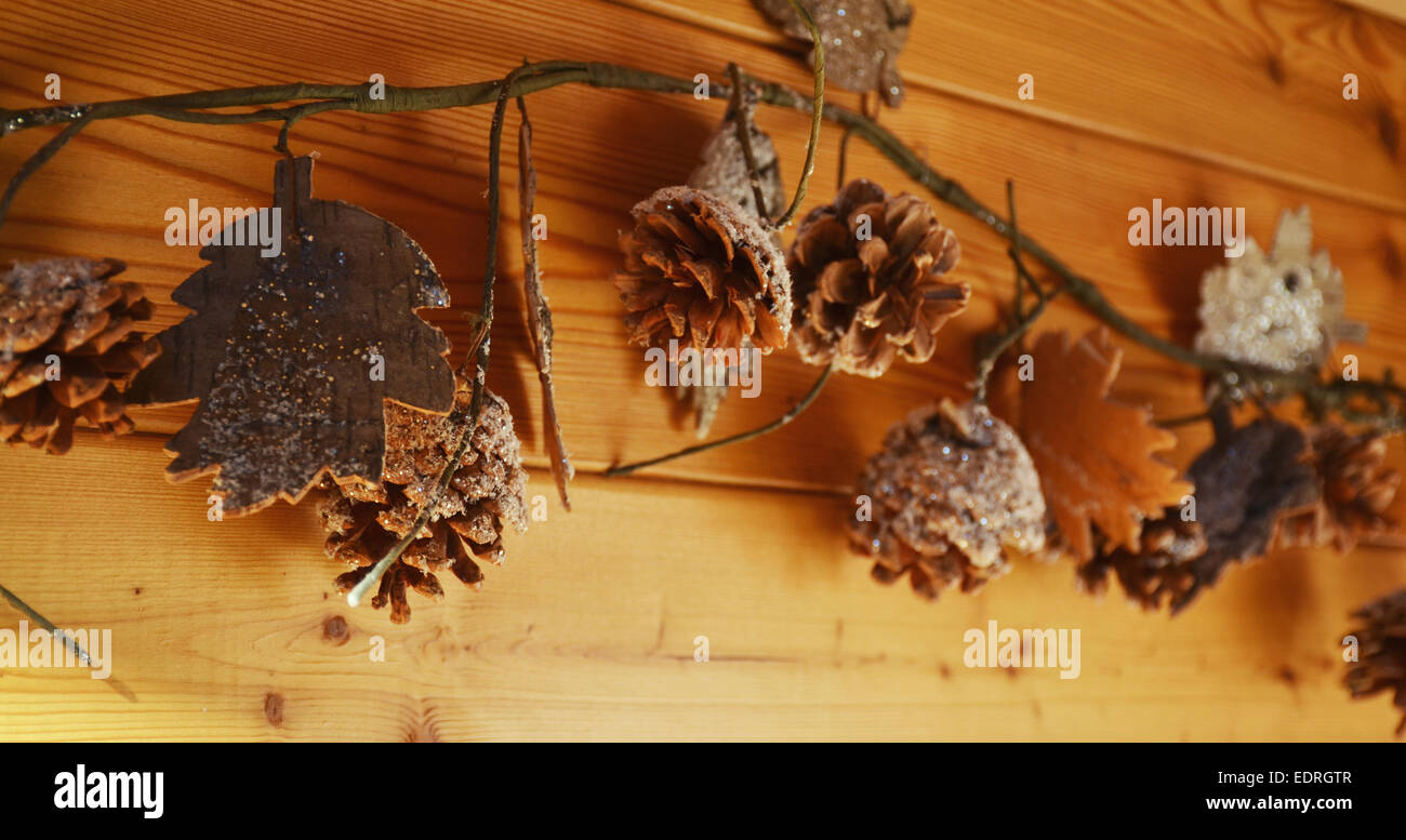Wooden Christmas decoration with cones Stock Photo