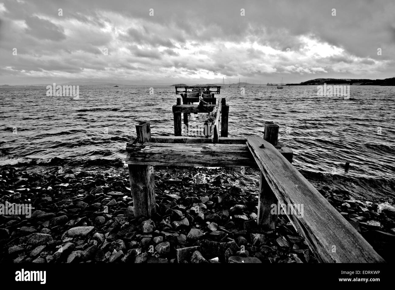 Hawcraigs Pier. grainy black and white wide angle Stock Photo