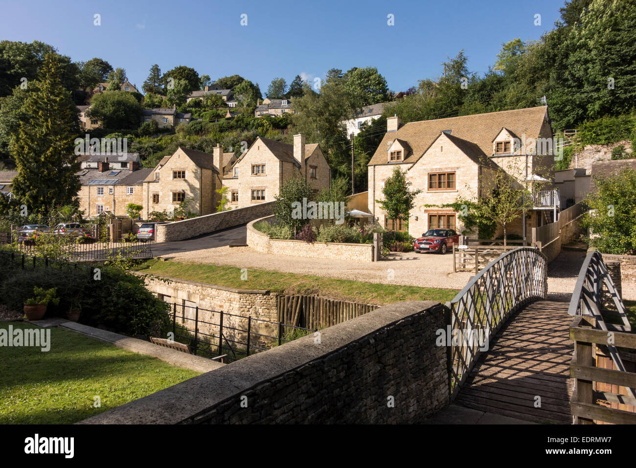 Newly built stone houses in Chalford by Thames and Severn Canal