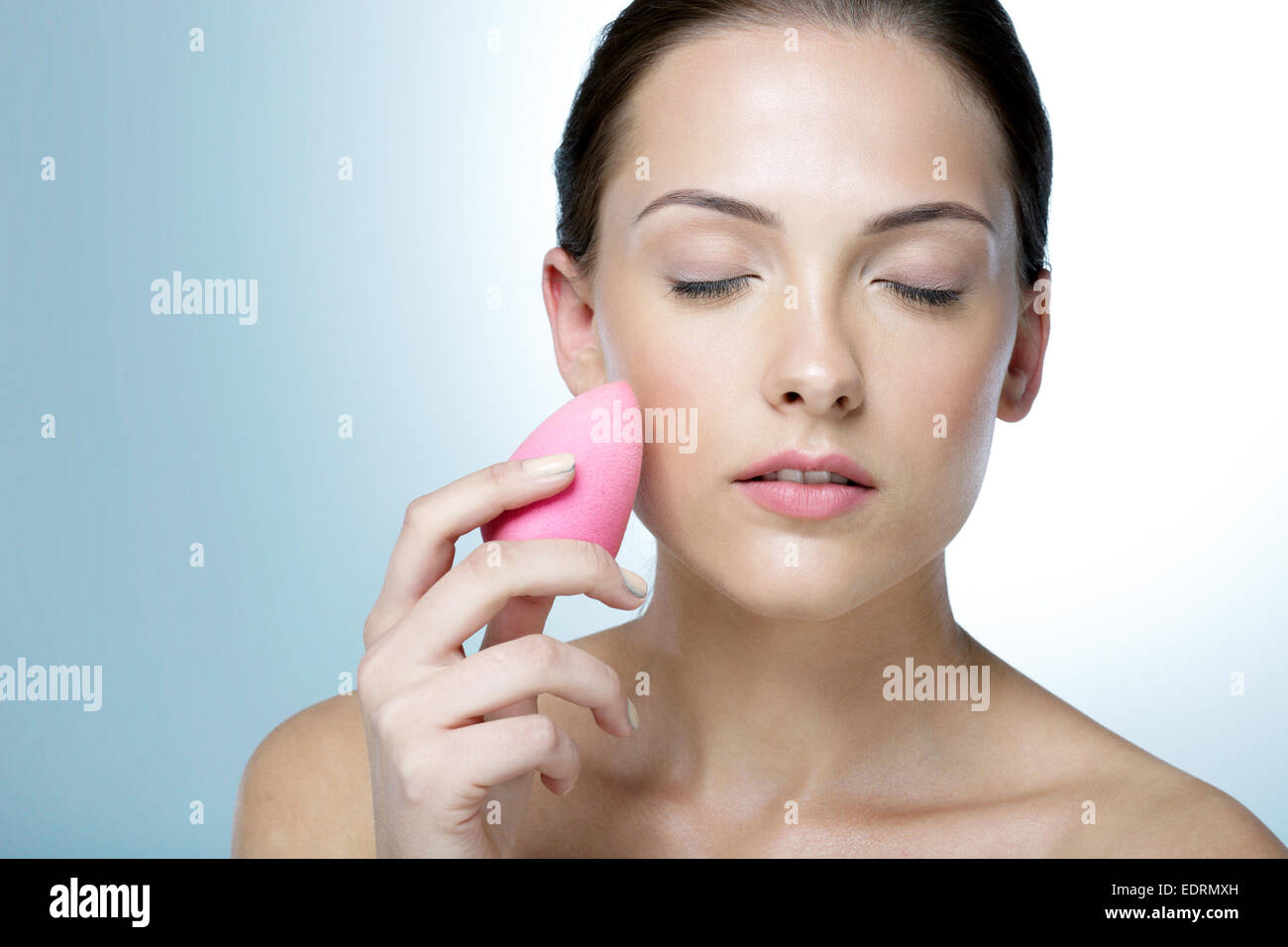 Attractive woman cleaning his face with closed eyes Stock Photo Alamy