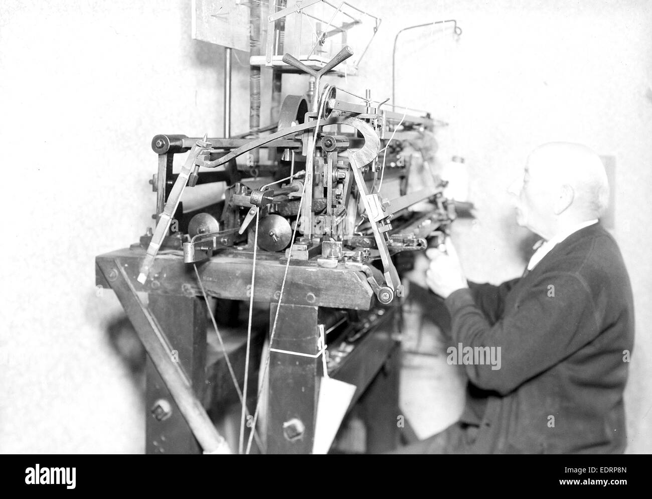 Philadelphia, Pennsylvania - Hosiery. Minnesac Mills. [Man working at machine.], May 1937, Lewis Hine, 1874 - 1940 Stock Photo