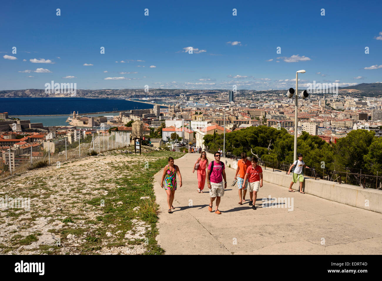 Group of tourists walking up the hill which leads to Notre Dame de la Garde, Marseille, PACA, France Stock Photo