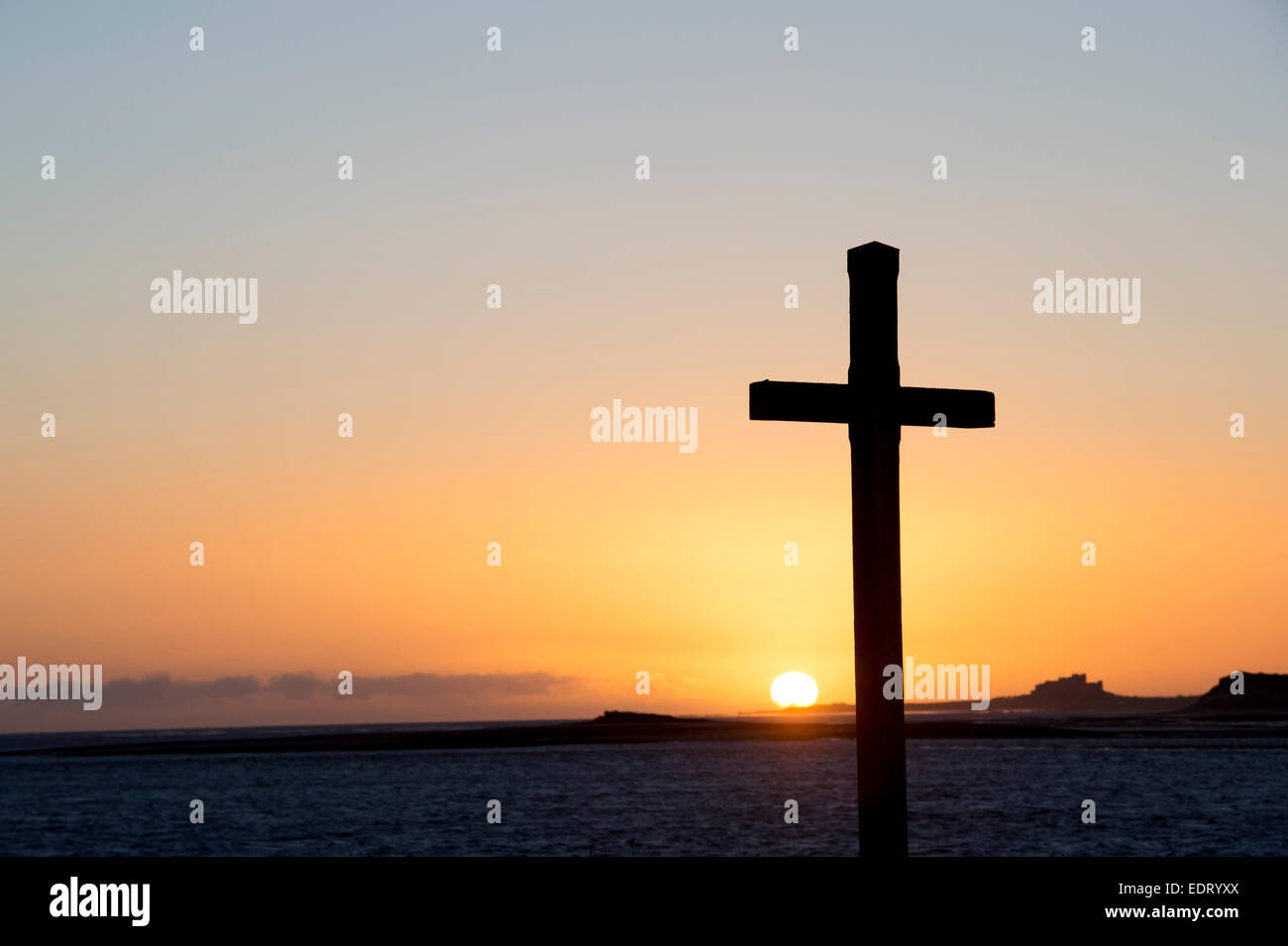 St Cuthbert's Isle wooden cross on Holy Island, Lindisfarne at sunrise