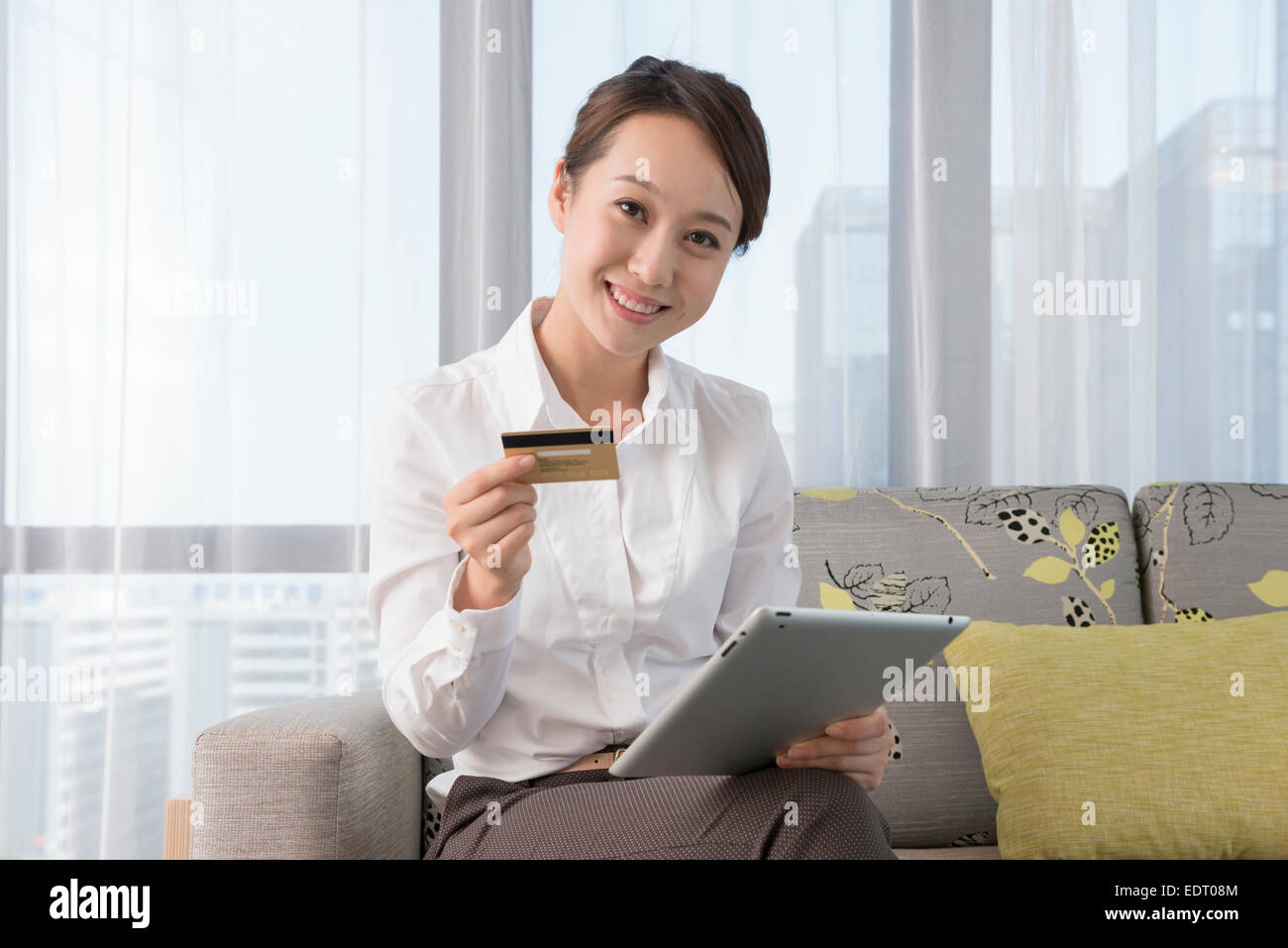 Young woman shopping online Stock Photo