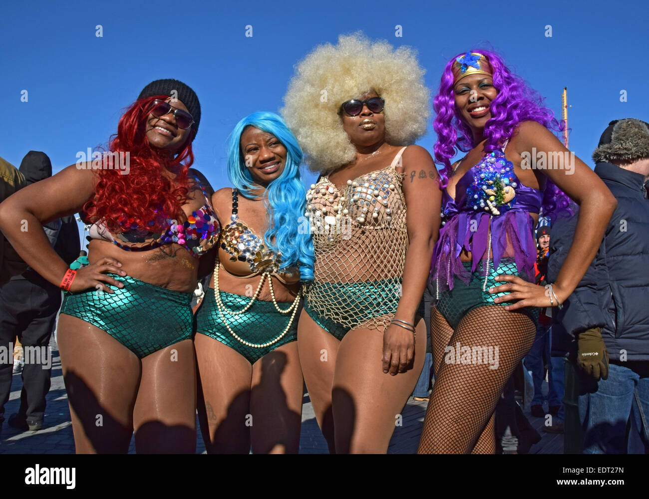 4 women dressed as mermaids for the annual Polar Bears New Years day swim in Coney Island Brooklyn, New York Stock Photo