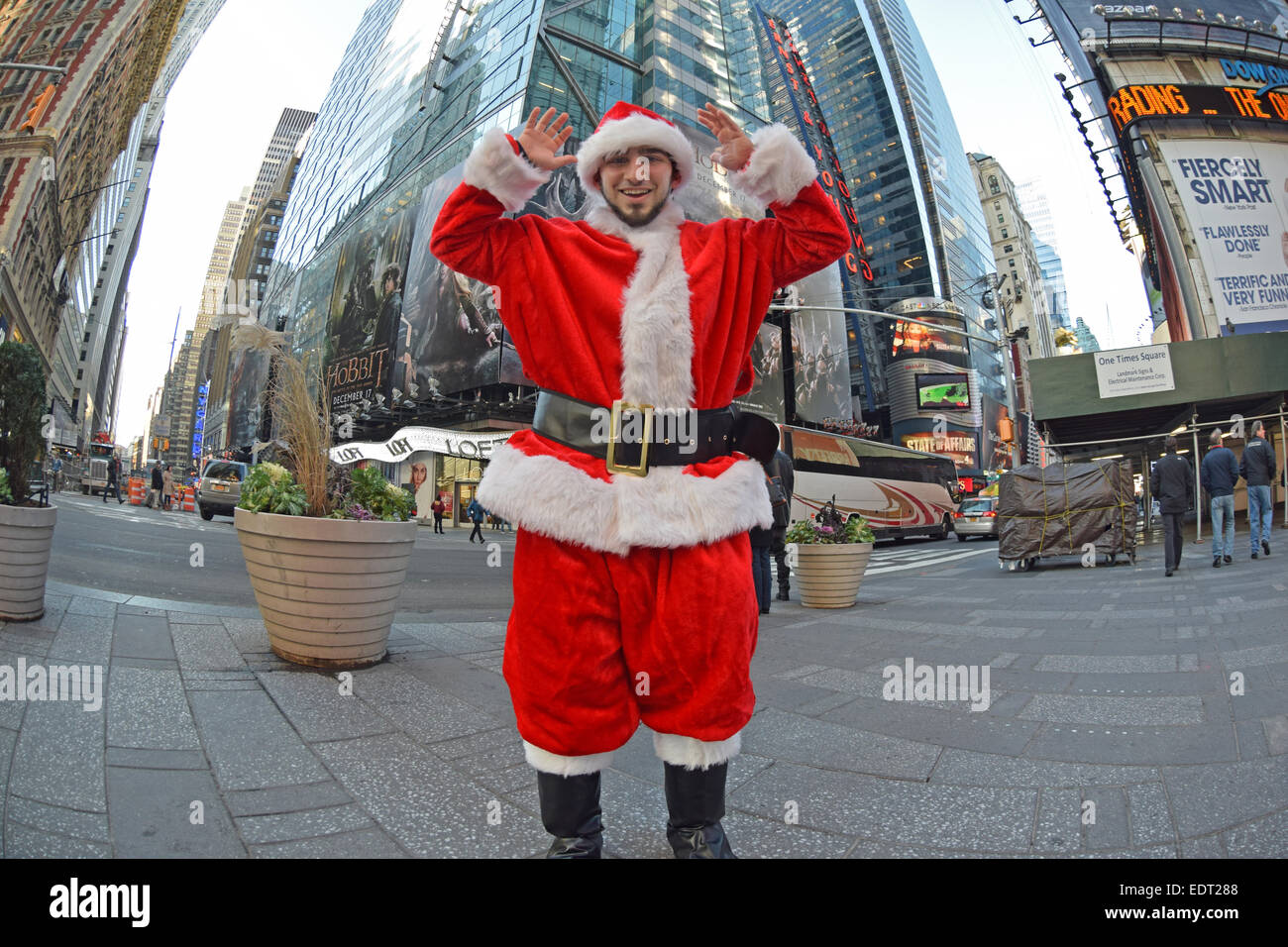 A young man dressed as Santa Claus in Times Square, Midtown Manhattan. New York City Stock Photo