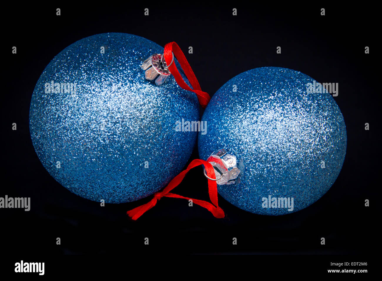Glittery Christmas balls on a black background Stock Photo