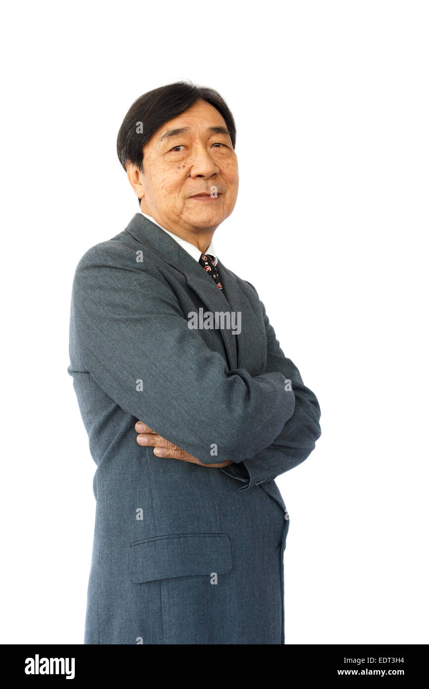 old aged thai businessman is standing and looking on white background(isolated) Stock Photo