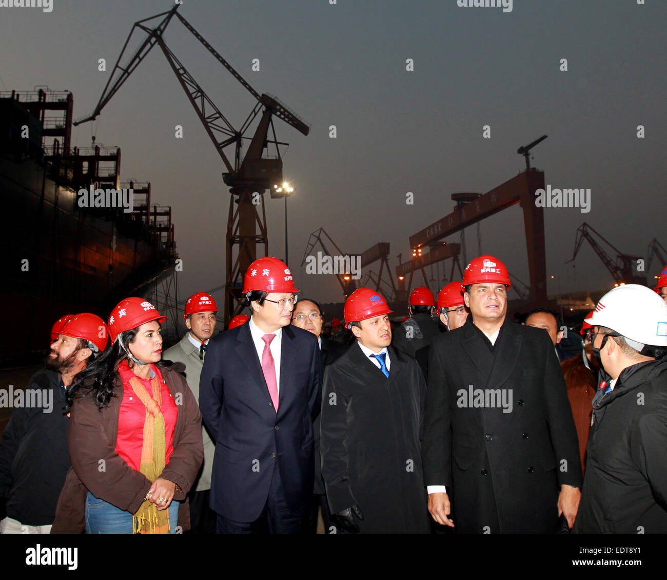 Shanghai, China. 9th Jan, 2015. Ecuadorian President Rafael Correa Delgado (2nd R) visits a dockyard at Changxing Island of Shanghai, east China, Jan. 9, 2015. © Ren Long/Xinhua/Alamy Live News Stock Photo