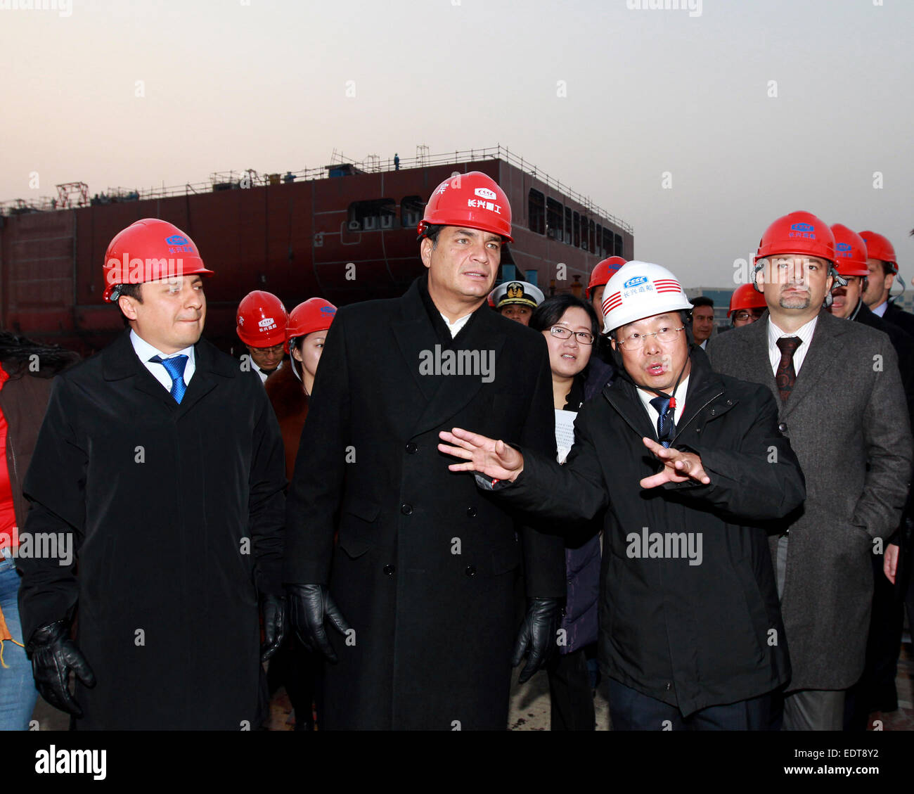 Shanghai, China. 9th Jan, 2015. Ecuadorian President Rafael Correa Delgado (C front) visits a dockyard at Changxing Island of Shanghai, east China, Jan. 9, 2015. © Ren Long/Xinhua/Alamy Live News Stock Photo