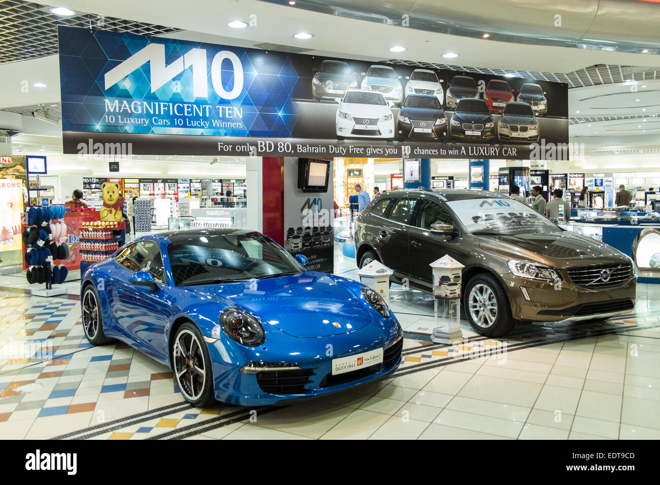 Lottery at Duty Free for blue Porsche and brown Volvo at Bahrain International Airport, Bahrain, Middle East Stock Photo