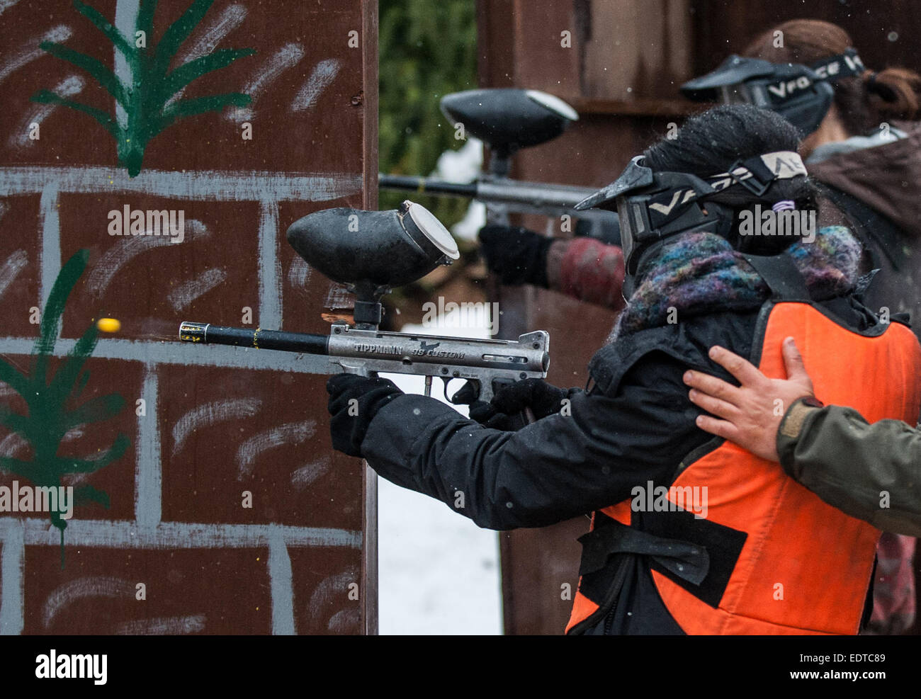 (150109) -- GUSH ETZION, Jan. 9, 2015 (Xinhua) -- A student shoots a paintball during a military and counter-terror drill at 'Caliber 3' Israeli Counter Terror and Security Academy in Gush Etzion, south of Jerusalem, on Jan. 9, 2015. One hundred China's Hong Kong students and teachers started the four-day Techcacker Lab programme jointly organized by the Li Ka Shing Foundation and the Technion-Israel Institute of Technology. The Techcracker Lab programme is designed around the Hebrew word 'chutzpah', which means fearless and audacious, and epitomizes the dedication, vigor, and tremendous succe Stock Photo