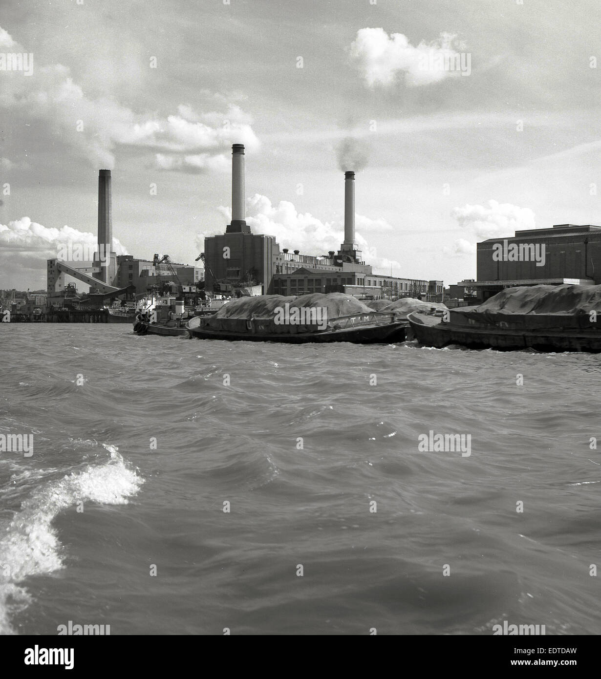 1950s historical picture of the Thames bank power station beside the River Thames, London, England. Stock Photo