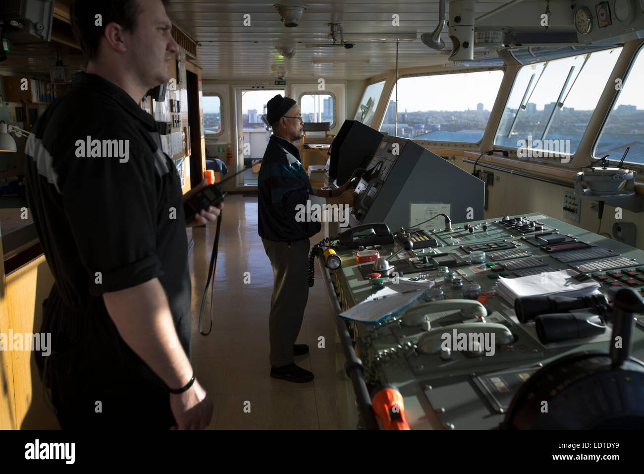 The crew working on the bridge of the Panama-registered container ship MSC Sandra, Seaforth Dock, Liverpool, England, UK. Stock Photo