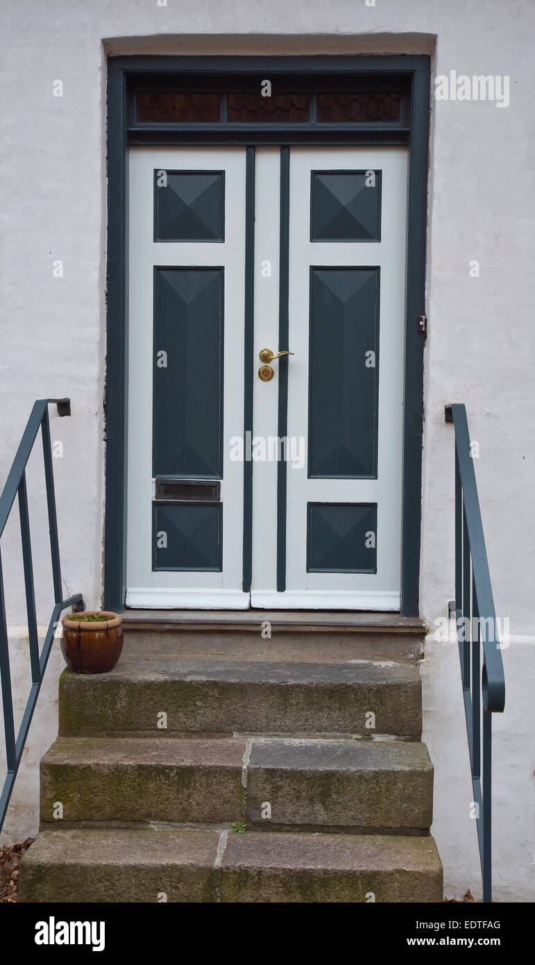 Double door with brass handle. Shot from Viborg, Denmark Stock Photo