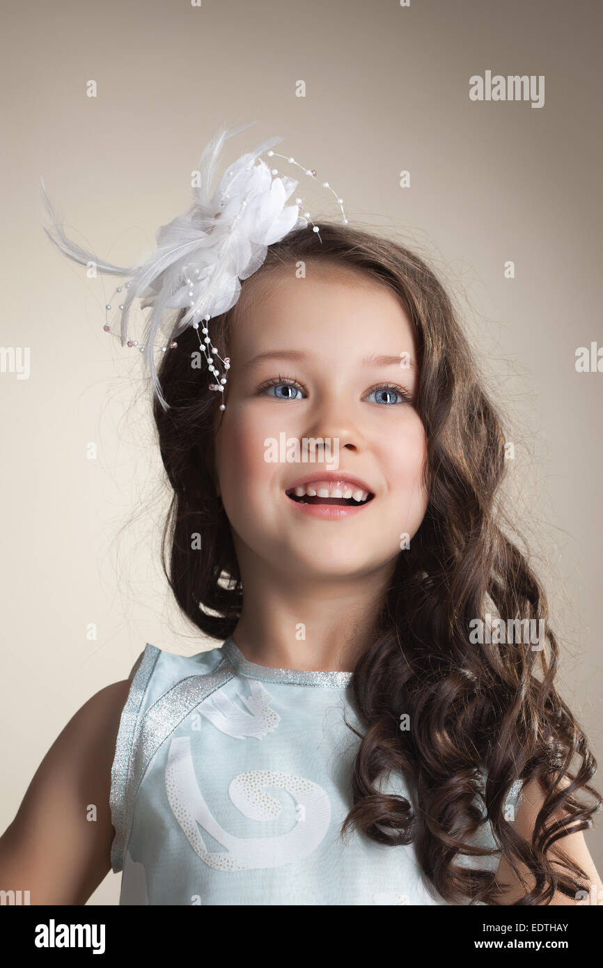 Portrait of elegant little girl posing in studio Stock Photo - Alamy