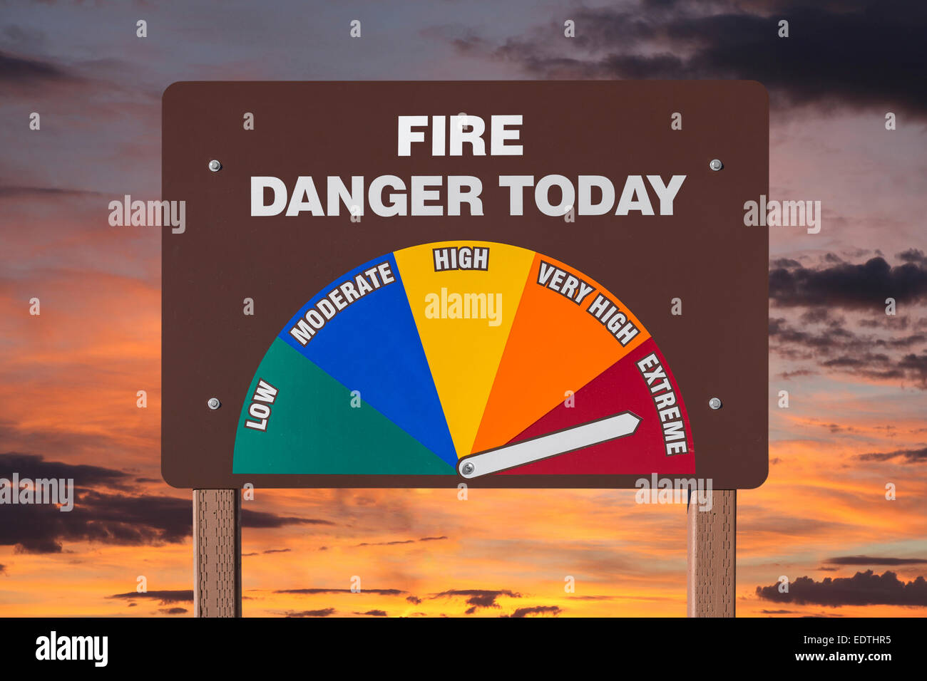 Extreme fire danger today sign with orange sunrise. Stock Photo