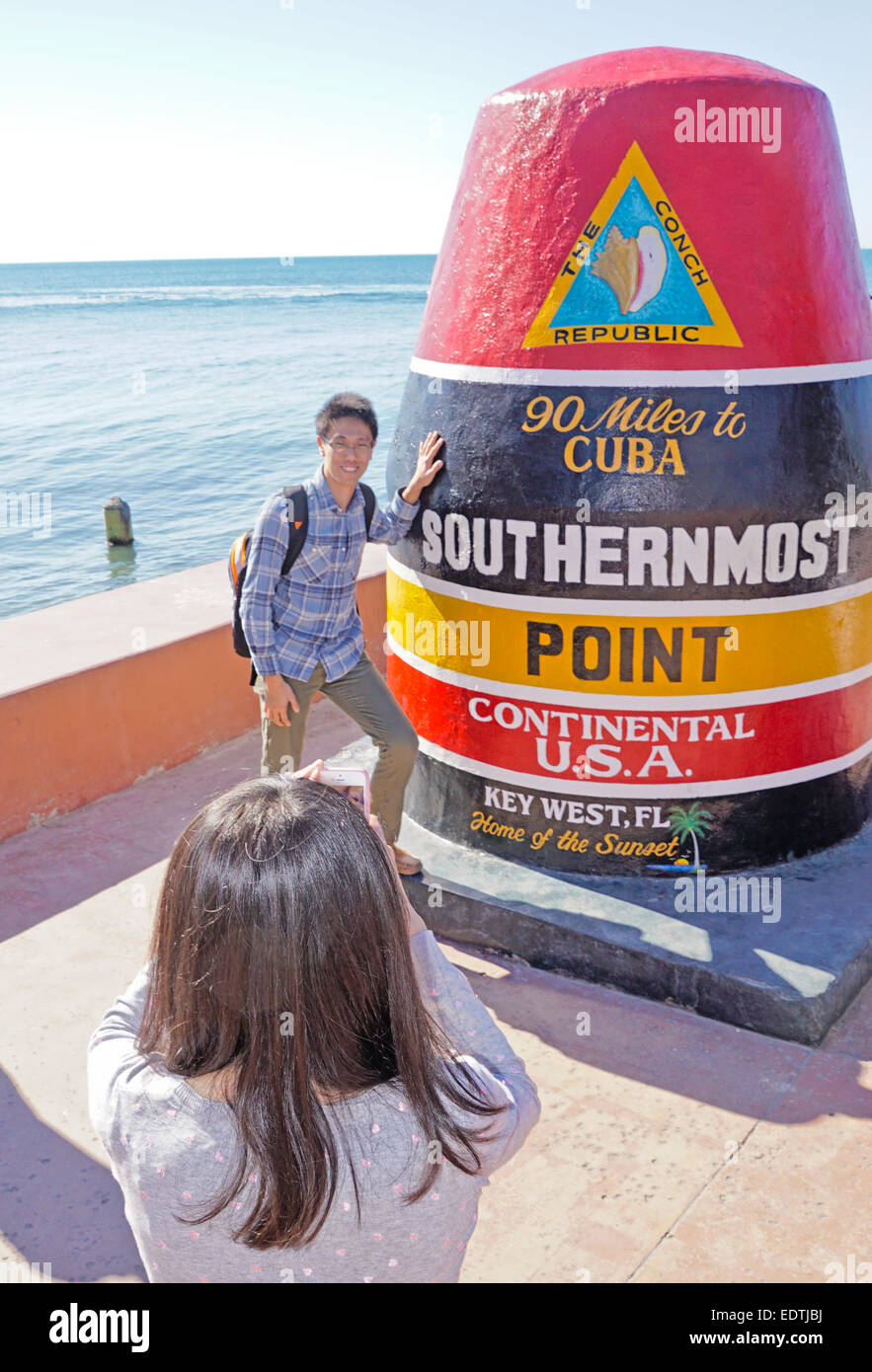 Southernmost point in continental U.S.A. marker is popular photo opportunity for foreign tourists in Key West. Stock Photo