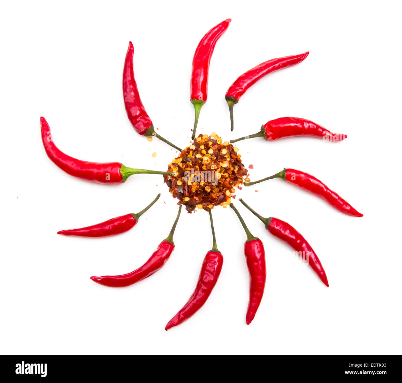 Hot peppers forming a sun on white background Stock Photo - Alamy