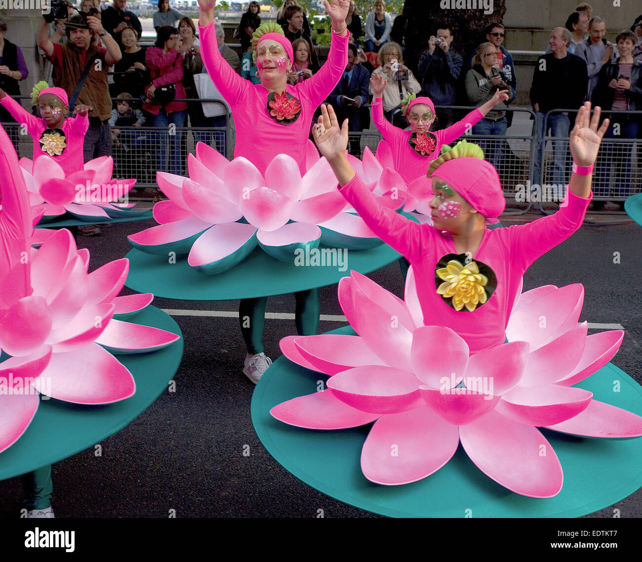 A teacher and her class of young girls, all dressed as water- lilies, take part in the Mayor's Thames Festival. Stock Photo