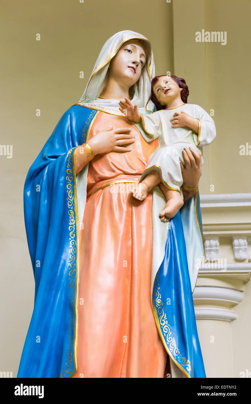 the statue of maria hold jesus in thai church Stock Photo