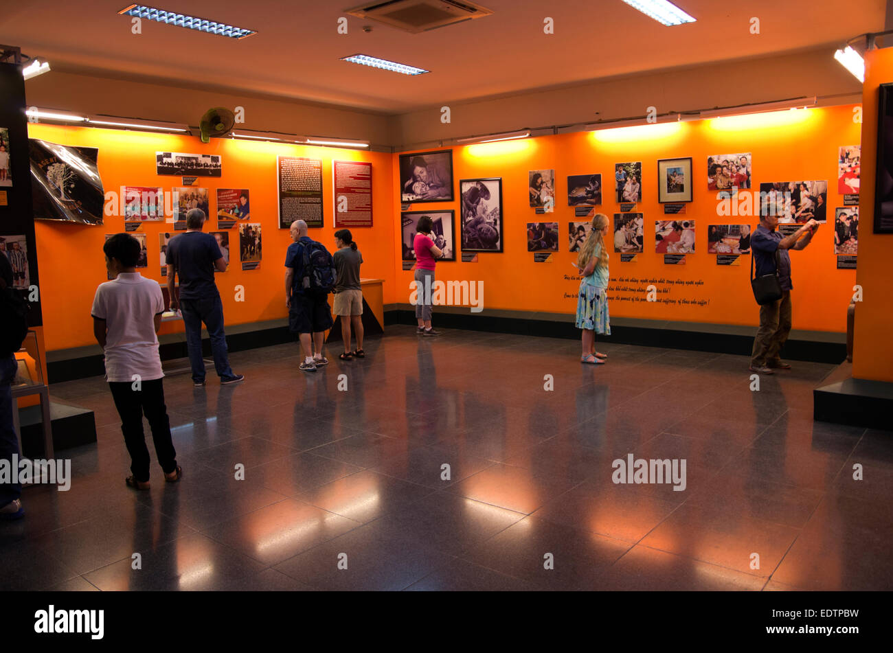 War Remnants Museum, Agent Orange Aftermath, people look at and photograph display, Saigon Ho Chi Minh City Stock Photo