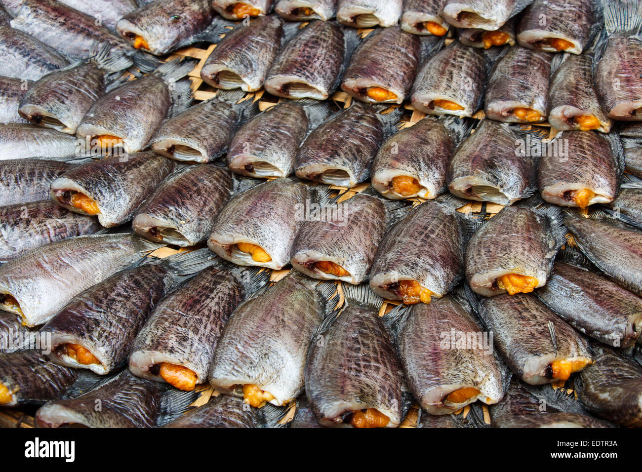Fishes meat(Trichogaster pectoralis) arrange on rattan in market Stock Photo