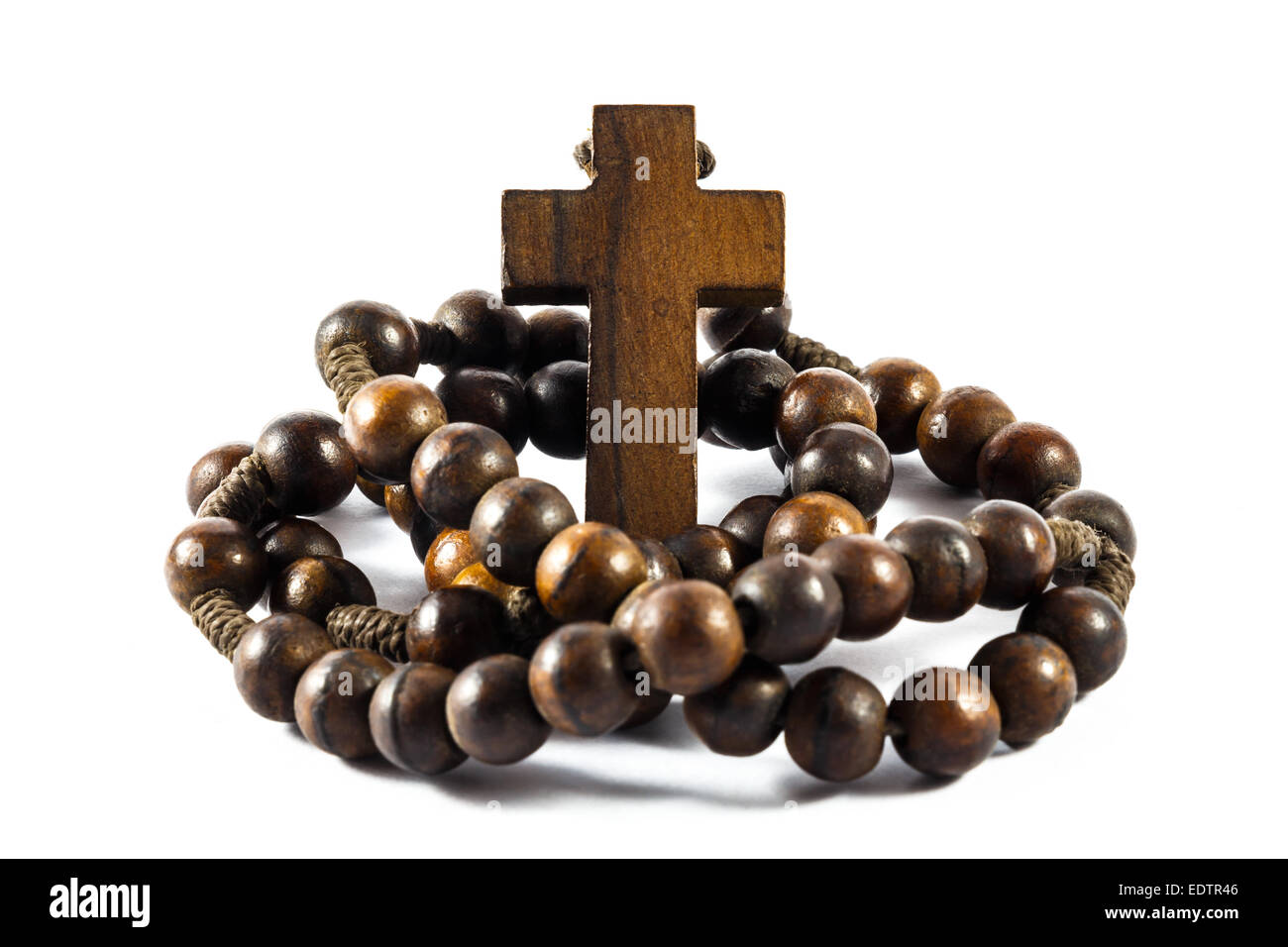 Wood rosary and cross with isolated background Stock Photo