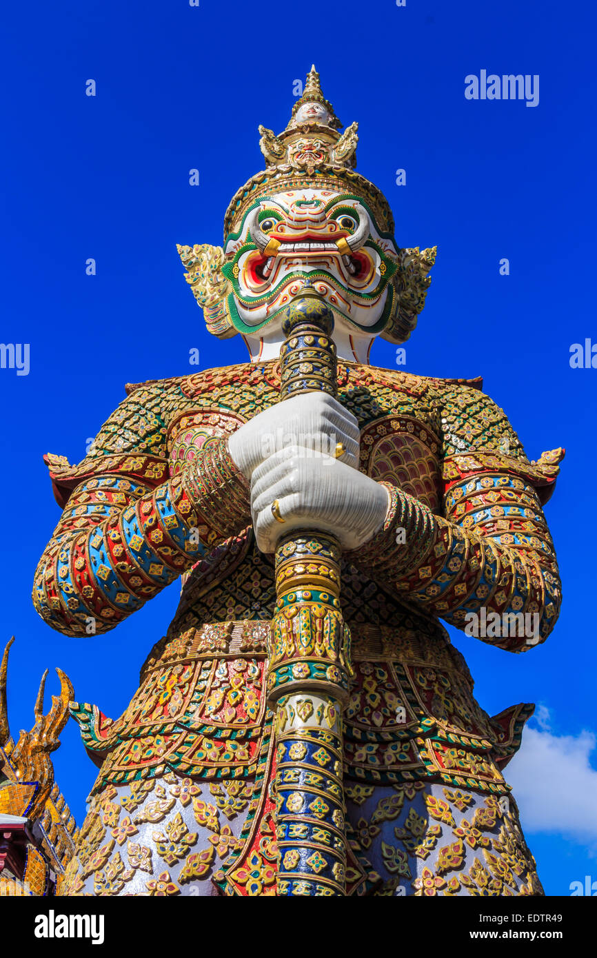 The statue of giant hold club and blue sky in Wat Phra Kaew ,Thailand  (Ant's Eye View) Stock Photo