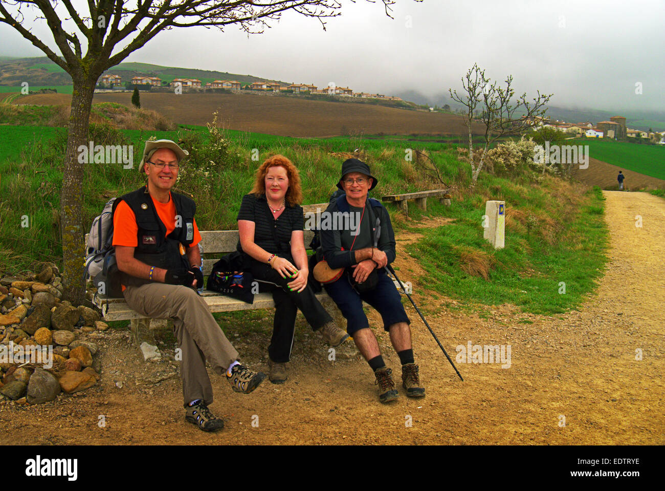 Pilgrims resting On the road to Cizur Menor,  on El Camino De Santiago De compostela in Spain. Stock Photo