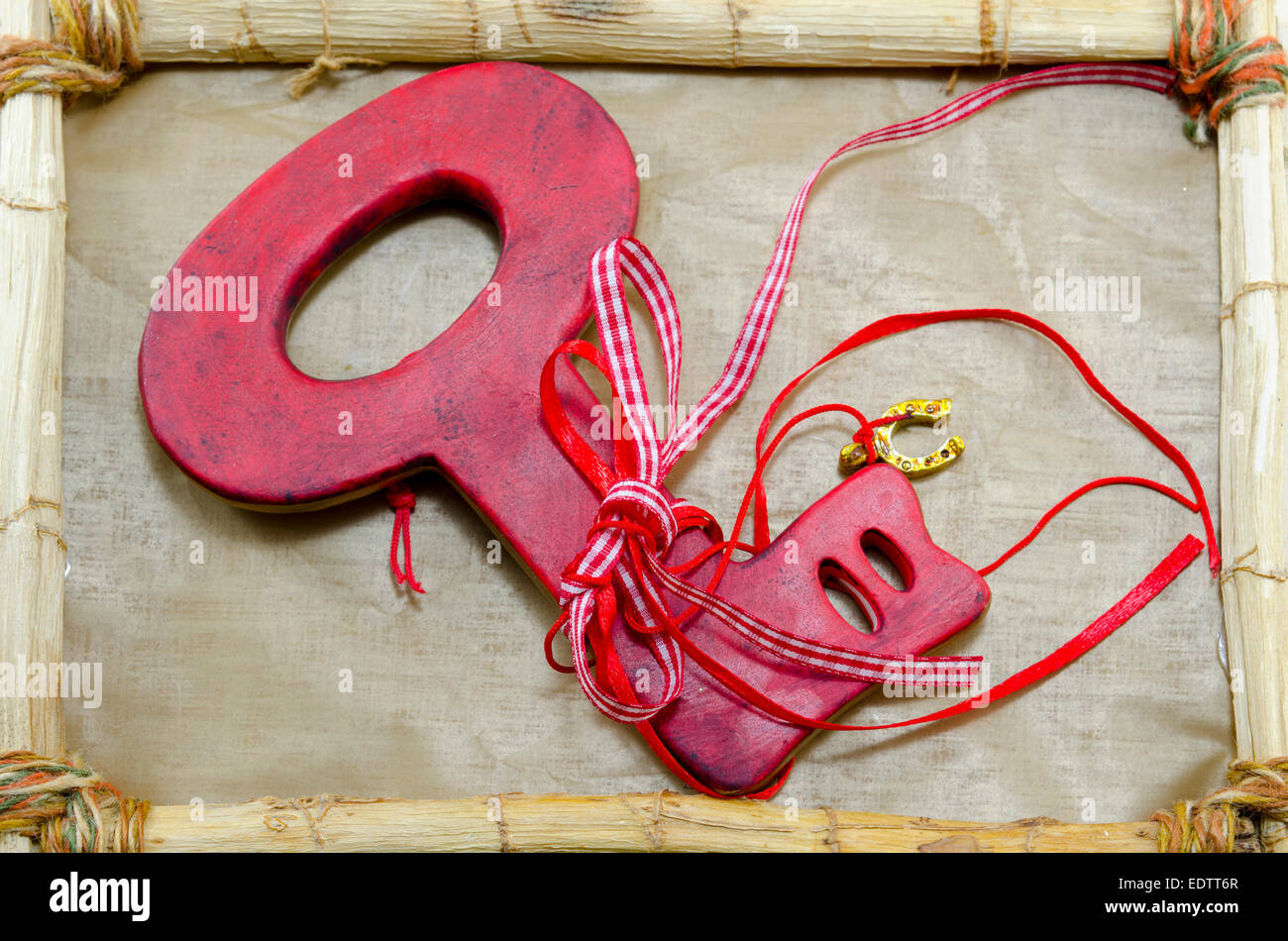 Red wooden key on a frame Stock Photo